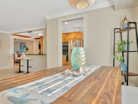 Open and Comfortable Family Room Layout with SmartTV and Table