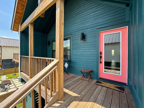 Book today and come relax on the charming porch—your inviting coastal home awaits!
