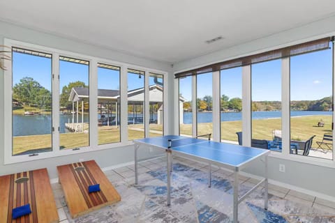 Stunning view of the water front with provided corn hole and ping pong!