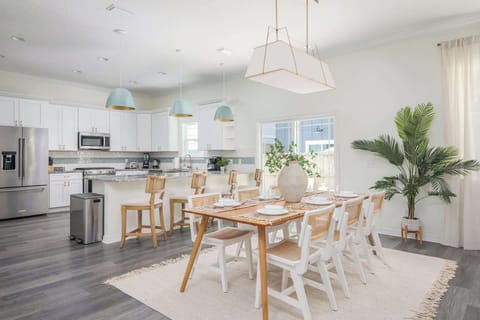 "Host gatherings in this wide kitchen and dining space with quartz island, stainless appliances and seating for six. Cooking and conversation flow easily here. - The Coquina - St. Augustine, FL"