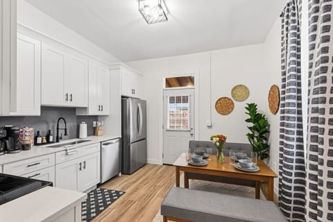 Fully Equipped Kitchen: Prepare meals with ease thanks to all new stainless steel appliances, white shaker cabinets, and comfortable dining for four—make yourself at home and enjoy a meal!