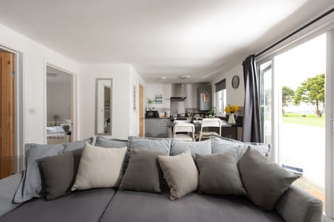 Open plan living area with corner sofa and chairs seating four, TV with Sky package, Amazon Alexa