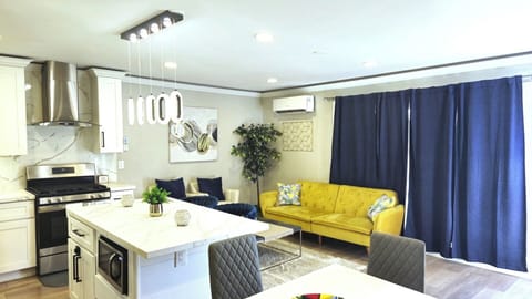 Cozy and inviting living room with stylish decor, comfortable seating, and a warm ambiance, perfect for relaxation and unwinding