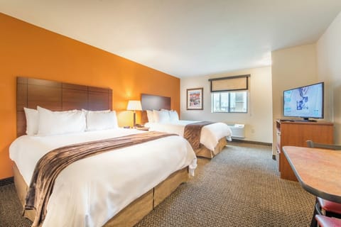 Unwind in a bright double-queen room with HDTV.