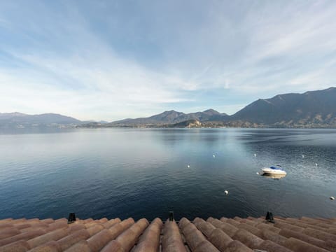 Blue, Sky, Water, Mountainous Landforms, Body Of Water, Mountain, Water Resources, Horizon, Hill, Coastal And Oceanic Landforms