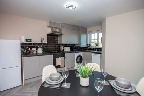 Fully equipped kitchen with sleek finishes and everything you need to cook at home