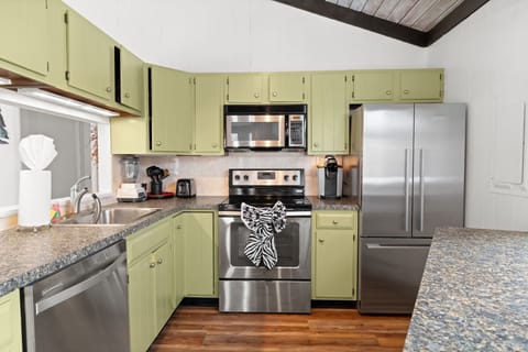 Retro-style kitchen with counter seating perfect for family meals at Lake Naomi retreat