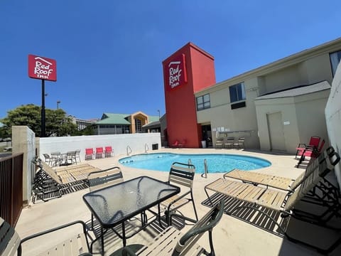 Unwind poolside under blue skies with plenty of seating.