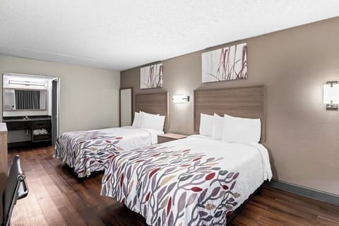 Enjoy extra space to unpack and relax between two plush beds.