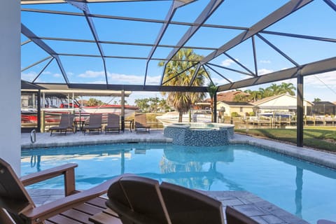 Perched on a Gulf access canal, the sundeck, pool and spa create the perfect setting for peaceful, coastal living in Southwest Florida.