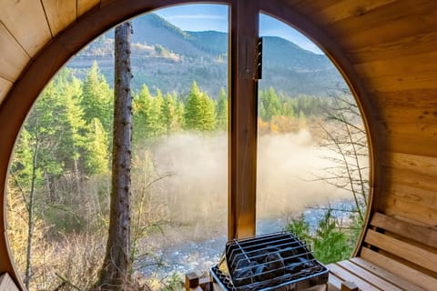 Unwind in the cedar sauna overlooking the river and mountains—your own quiet retreat where warm steam meets crisp alpine air.