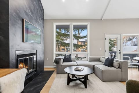 Newly renovated living room with vaulted ceilings bright lighting