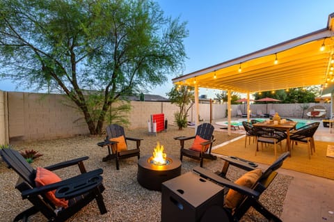 Your own private backyard retreat featuring a fire pit, outdoor dining, pool, lawn games, and plenty of space to relax.