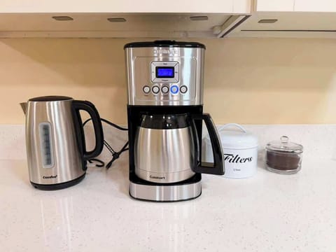 Wake up to fresh coffee with both an electric kettle and a drip coffee maker.