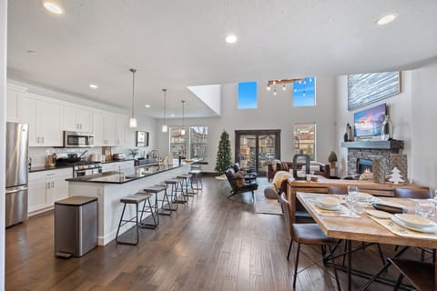 Bright open concept living, dining, and kitchen space.