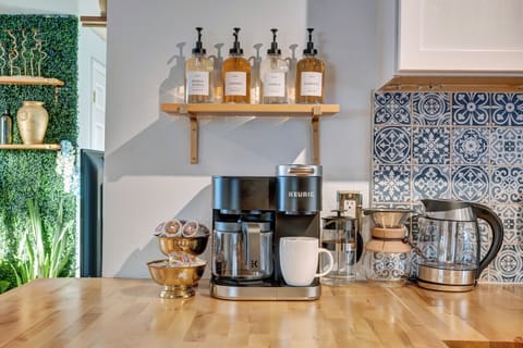 Start your day right with a deluxe coffee setup—drip, Keurig, French press, and a variety of syrups to suit every taste.
