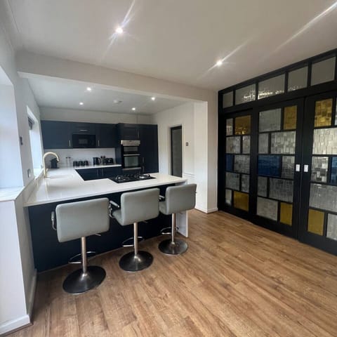 Open-plan kitchen with breakfast bar