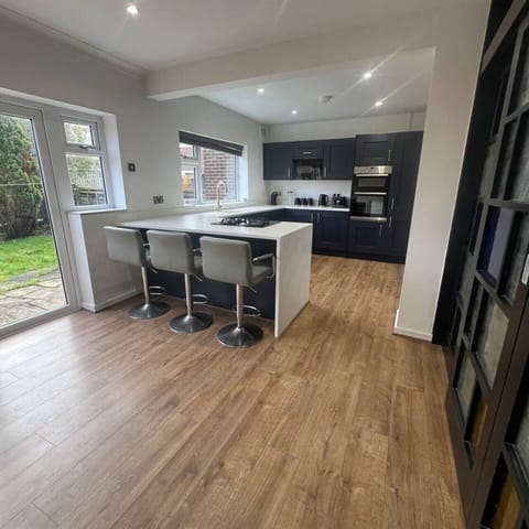 Open-plan kitchen with breakfast bar