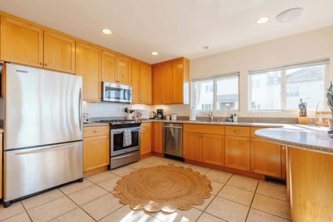 Savor meals prepared in the gourmet kitchen, featuring high-end appliances and a stylish dining area perfect for memorable gatherings.