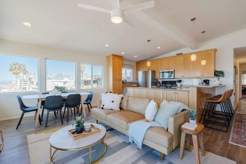 This spacious living room is perfect for family gatherings, offering plenty of seating and a welcoming ambiance.