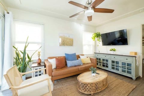 Relax and unwind with friends in the bright, sun-filled living room 