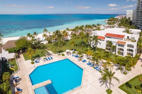Picture mornings overlooking turquoise water and sunlit resort pool.