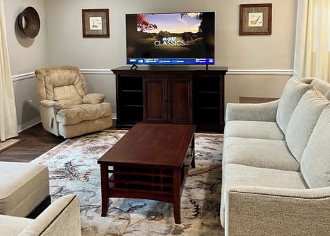 Living room with couch, love seat and recliner