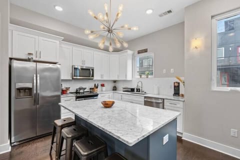 Kitchen: A modern kitchen with sleek finishes and updated appliances.