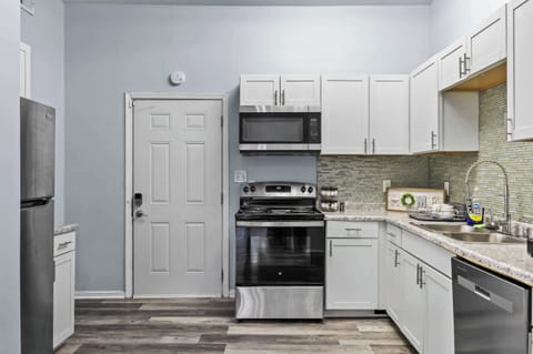 Kitchen: Full-size appliances & ample counter space for long-term comfort. Cook all your meals easily! Functionality is key for extended stays.