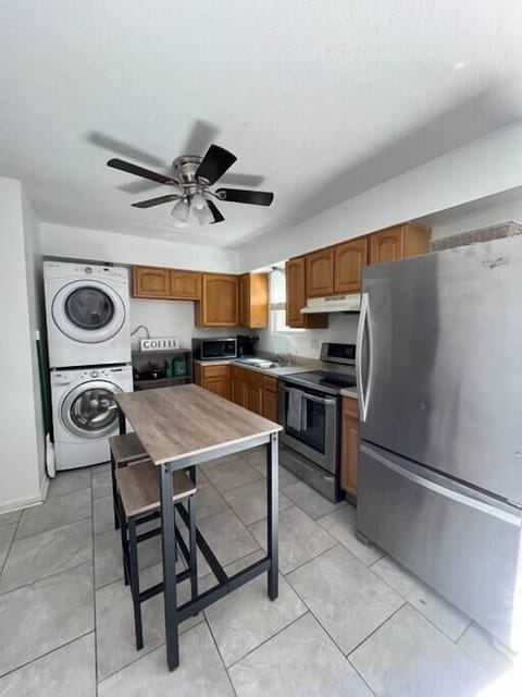 Kitchen: Enjoy the perks of our kitchen and laundry room combo, designed to give you the best of both worlds in a convenient way.