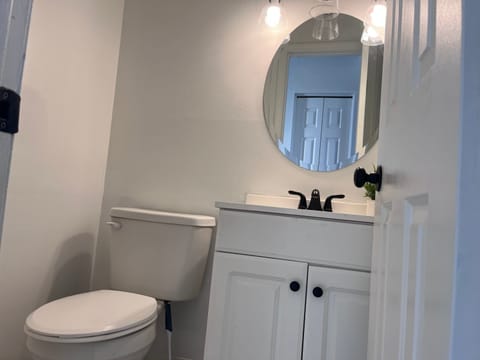 Half Bathroom: The vanity area is clean and has complimentary toiletries, so you can quickly freshen up before you head out.