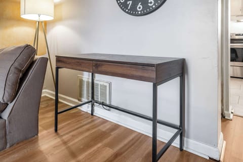 Living Room: A desk is also provided for work or study. 