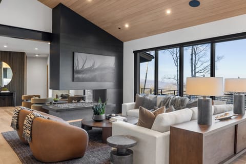 Gorgeous living room with gas fireplace, huge Samsung TV, and amazing views