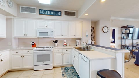 Modern kitchen with full sized appliances.