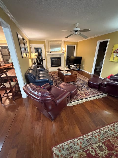 Full view of the living room that shows access to half bath