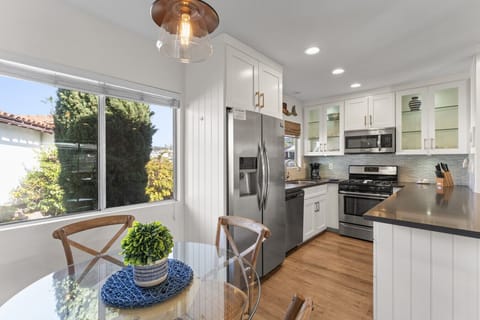 Fully equipped gourmet kitchen with granite counters and modern appliances.