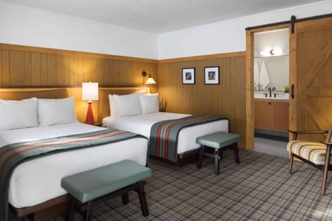 Settle in with spacious double beds and warm wood accents.