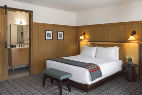 Drift off in a warm, wood-accented bedroom retreat.