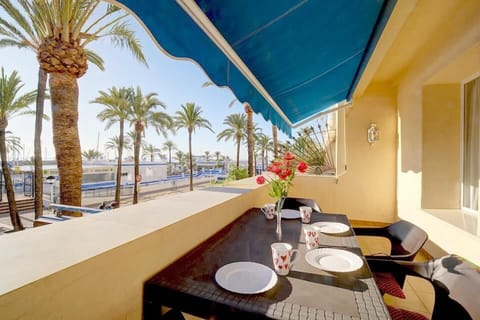 Large terrace with outdoor dining area for four guests and sea views