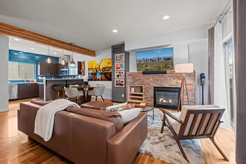 Stylish open-concept living space with modern furnishings and Smart TV—perfect for unwinding after exploring Denver