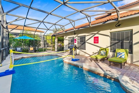 Poolside Fun – Enjoy your private screened-in pool complete with a volleyball net, lounge seating, and a grill for the perfect Florida getaway.