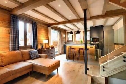Comfortable lounge and kitchen, with steps up to dining level