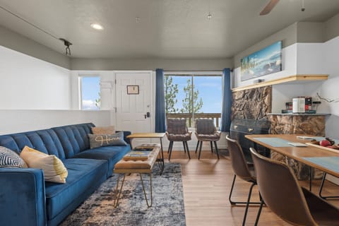 Our cozy living room features an electric fireplace, comfortable sofa that pulls out into a bed and a smart TV with cable. 