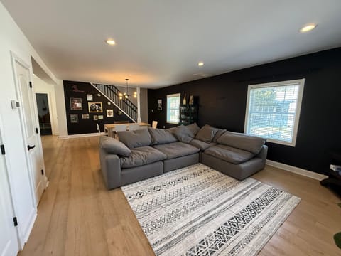 Open-concept living room with smart TV, relax and stream after exploring Indy.
