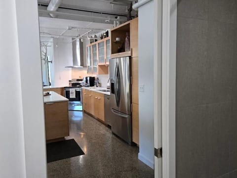 View of kitchen from main bathroom