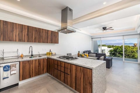 Prepare meals with ease in the stylish kitchen featuring granite countertops, stainless steel appliances, and an open layout perfect for entertaining.