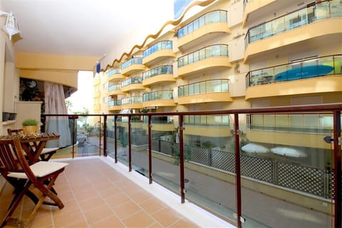 Large terrace with outdoor seating for two guests and sea views