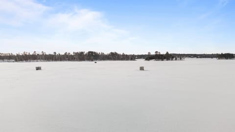 Winter on Clamshell Lake, part of the Whitefish Chain of Lakes, is quiet and wide open—snow-covered shoreline, frozen water, and crisp air that makes every walk, ride, or sunset feel unforgettable.