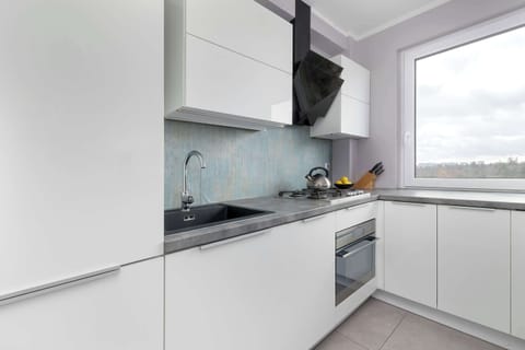 The kitchen offers a functional layout for convenient cooking.