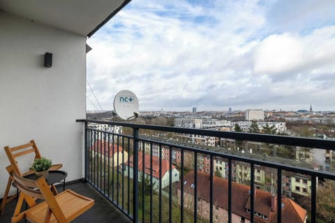 Furnished balcony with a beautiful city view.